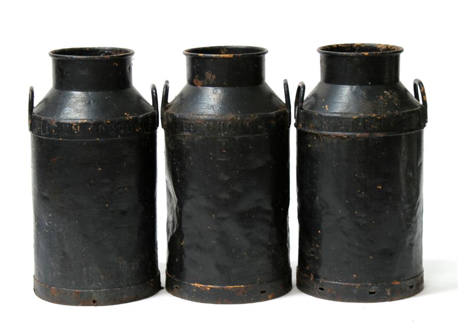 Three Carmarthen black painted milk churns, 67cms (26.5ins) high (a/f) (3).