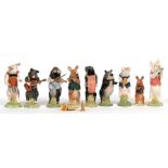 A nine piece Beswick pig band. Condition Report 5 with losses to instruments, two loose instruments,