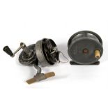 An H. Moore of Liverpool bi fishing reel, 7.5cms (3ins) diameter; together with a Pezon & Michel '