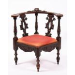 A 19th century Italian style carved walnut corner chair.
