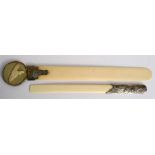An Art Nouveau white metal handled ivory letter opener, 31cms (12.25ins) long; together with a