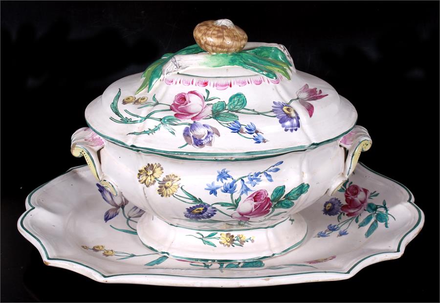 A faience pottery tureen & platter decorated with flowers, the tureen 30.5cms (12ins), the platter