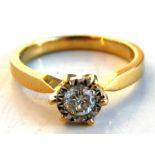 An 18ct gold diamond solitaire ring, UK size 'M'. Condition Report Weight 4.3g overall.