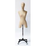 A dressmaker's mannequin dummy on stand.