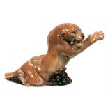 A German pottery figure in the form of a mountain lion, 28cms (11ins) high.