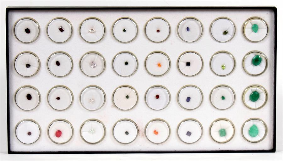 A cased set of thirty two semi-precious stone examples.
