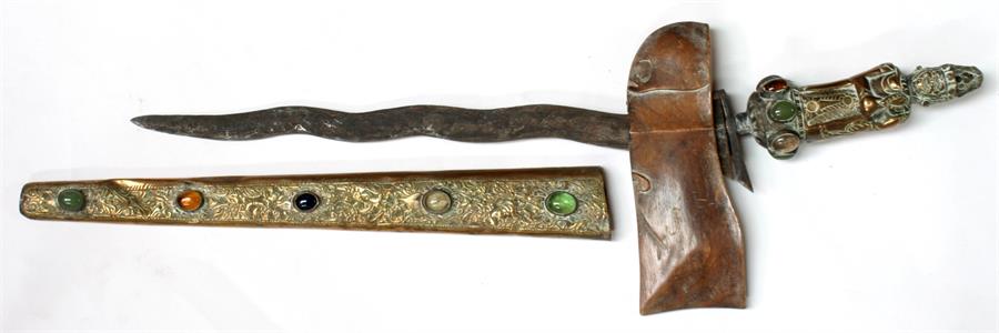 An Indonesian Kris with brass scabbard and figural handle, inset with cabouchons, 62cms (24.5ins) - Image 2 of 2