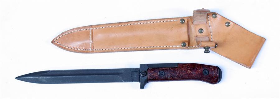 A Czech knife bayonet in its leather scabbard. Blade length 17.5cms (7ins)