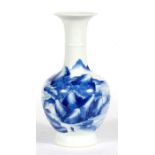 A Chinese blue and white vase decorated with a mountainous scene, 22cm (8.75ins) high. Condition