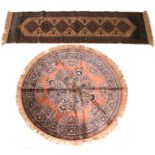 A machine made Belgium silk effect circular rug with central medallion within a foliate border on