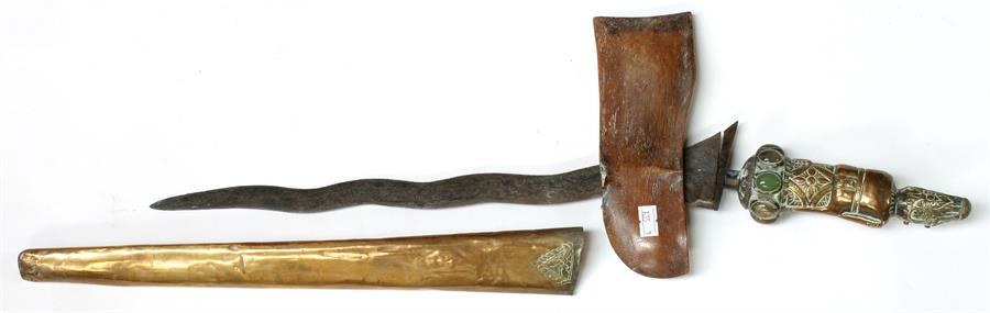 An Indonesian Kris with brass scabbard and figural handle, inset with cabouchons, 62cms (24.5ins)
