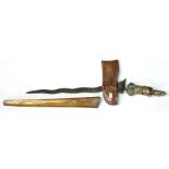 An Indonesian Kris with brass scabbard and figural handle, inset with cabouchons, 62cms (24.5ins)