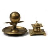 A Victorian brass eagle inkwell, 15cms (6ins) wide; together with a Victorian square form brass