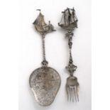 A Dutch silver sifting spoon, the bowl decorated with a windmill and figure, having a ship terminal,