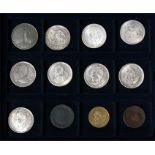 A collectors case of 12 coins and medallions