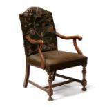 A 19th century walnut carver chair, with upholstered seat and back.