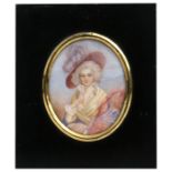 A 19th century portrait miniature painted on ivory, depicting a young woman wearing a bonnet, in