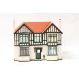 A vintage dolls house. 81cm (32ins) wide