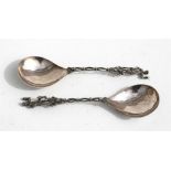 A pair of Dutch silver spoons with huntsman and hound terminals, 19cms (7.5ins) long, weight 99g.