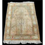 A Turkish Keyseri rug decorated with the Tree of Life pattern, on a cream ground, 120 by 175cms (