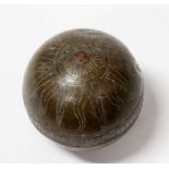 An early bronze ball, decorated with a sun (weighted), 11cms (4.25ins) diameter.