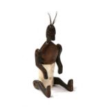 A tribal articulated wood and bone figure, 17cms (6.75ins) high.