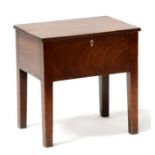 A mahogany sewing box containing a quantity of buttons, standing on square legs, 37cms (14.5ins)