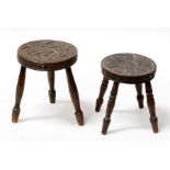 A small oak stool carved with a sunflower, standing on four turned legs; and another similar (2).