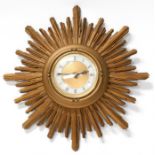 A giltwood star burst wall clock, the silvered dial with Roman numerals, 40cms (15.75ins)