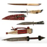 An African double ended arm dagger, 31.5cms (12.5ins) overall, a stiletto dagger with animal foot