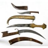 Three Indian jambiya knives in decorative scabbards. Blade lengths 24cms (9.5ins), 19cms (7.5ins)