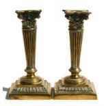 A pair of Regency brass candlesticks with reeded tapering column on square stepped base, 18.5cm (7.