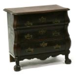 A continental oak chest of small proportions, with three long drawers and standing on ball & claw