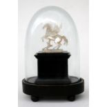 A 19th century mother of pearl figure in the form of a winged Pegasus, mounted on an ebonised stand,