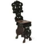 A 19th century Italian carved walnut hall chair.