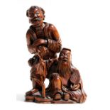 A Chinese figural root wood group depicting two elderly men, 31cms (12.25ins) high. Condition Report