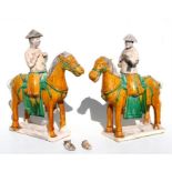 A pair of Sancai Tang Dynasty style Chinese horses and riders, 35cms (13.5ins) high.