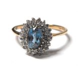 A 9ct gold topaz & diamond cluster ring, approx UK size 'P'.