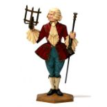 A cast iron figural table lamp in the form of a Regency dandy, 56cms (22ins) high. Condition