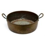 A large brass two-handled preserving pan, 48cms (19ins) diameter.