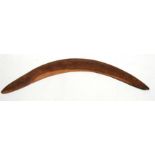 An Aboriginal hardwood boomerang, 63.5cms (25ins) wide.