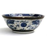 A Chinese blue & white crackle glaze bowl decorated with dragons chasing a flaming pearl amongst