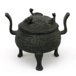 A Chinese bronze Warring State style archaic ding or censer, 17cms (6.75ins) high.