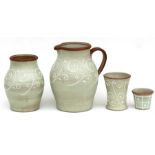 A large Denby stoneware jug, 32cms (12.5ins) high; together with three matching vases (4)
