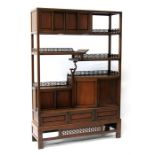 A Chinese hardwood multi- tiered hardwood display cabinet with a combination of cupboards and