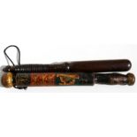 A turned mahogany truncheon, 37cms (14.5ins) long; together with another similar.