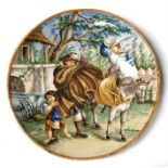 An Italian maiolica Castelli charger decorated with windswept figures, 34cms (13.5ins) diameter.