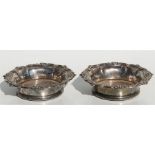 A pair of silver plated wine coasters, 19cms (7.5ins) diameter.