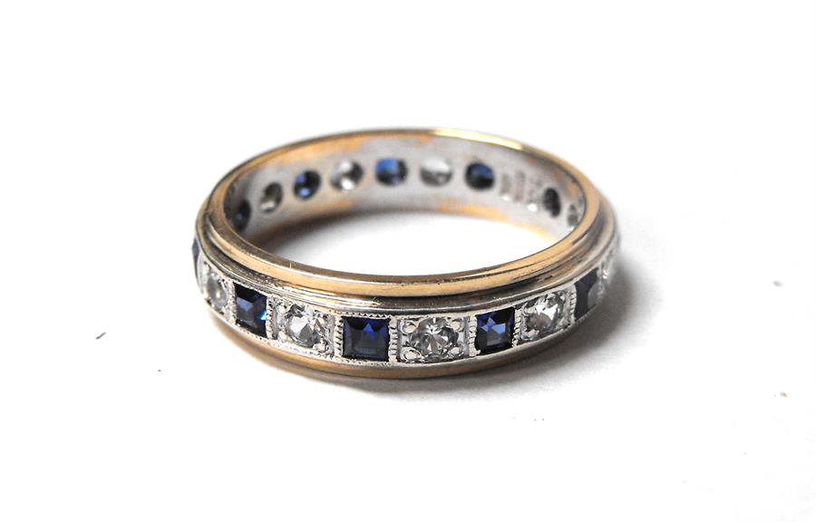 A 9ct gold blue & white sapphire eternity ring, approx UK size 'O'.
