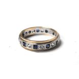 A 9ct gold blue & white sapphire eternity ring, approx UK size 'O'.